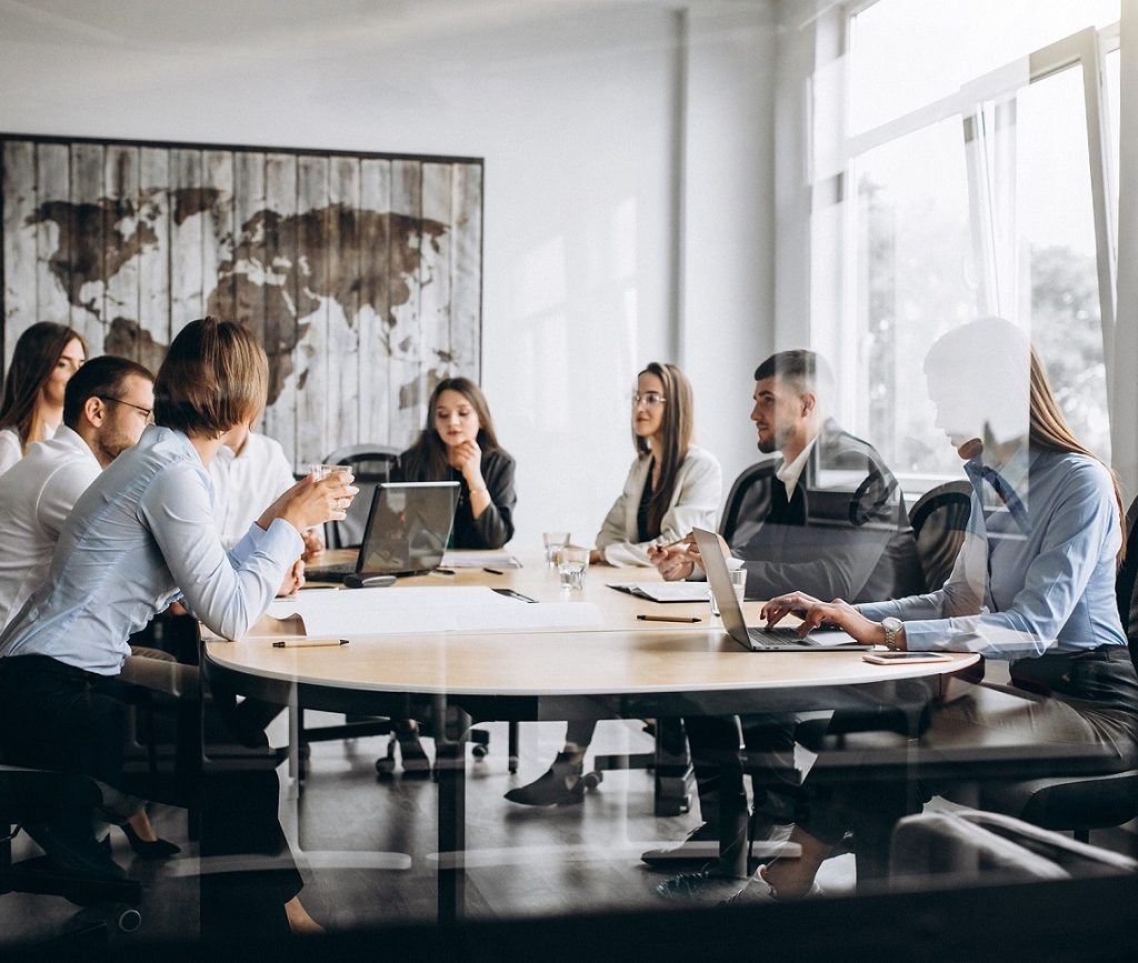 Group of people working out business plan in an office